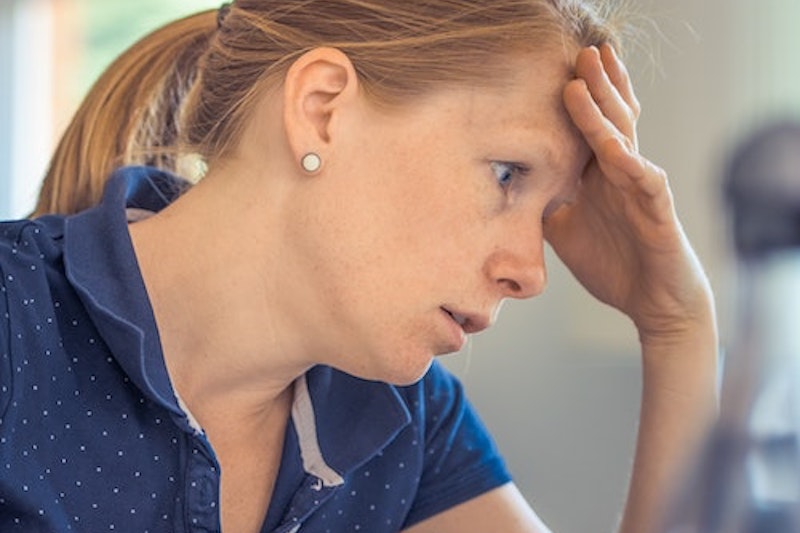 A woman looking troubled