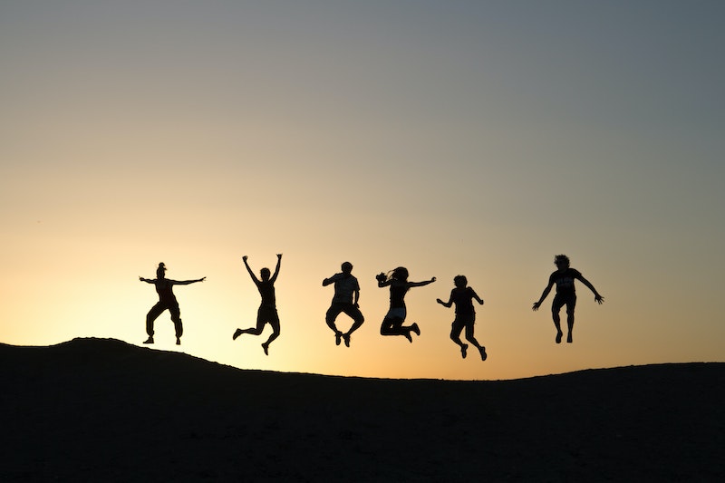 A team jumping in victory