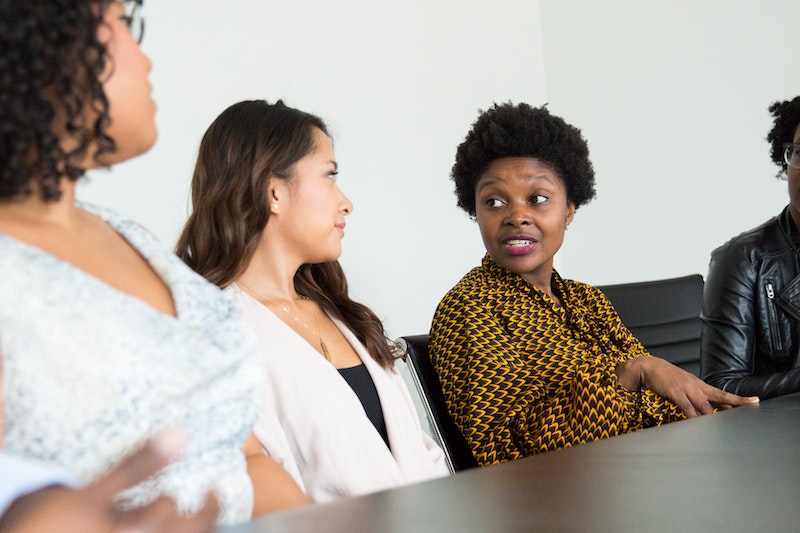 4 women discussing during a meeting
