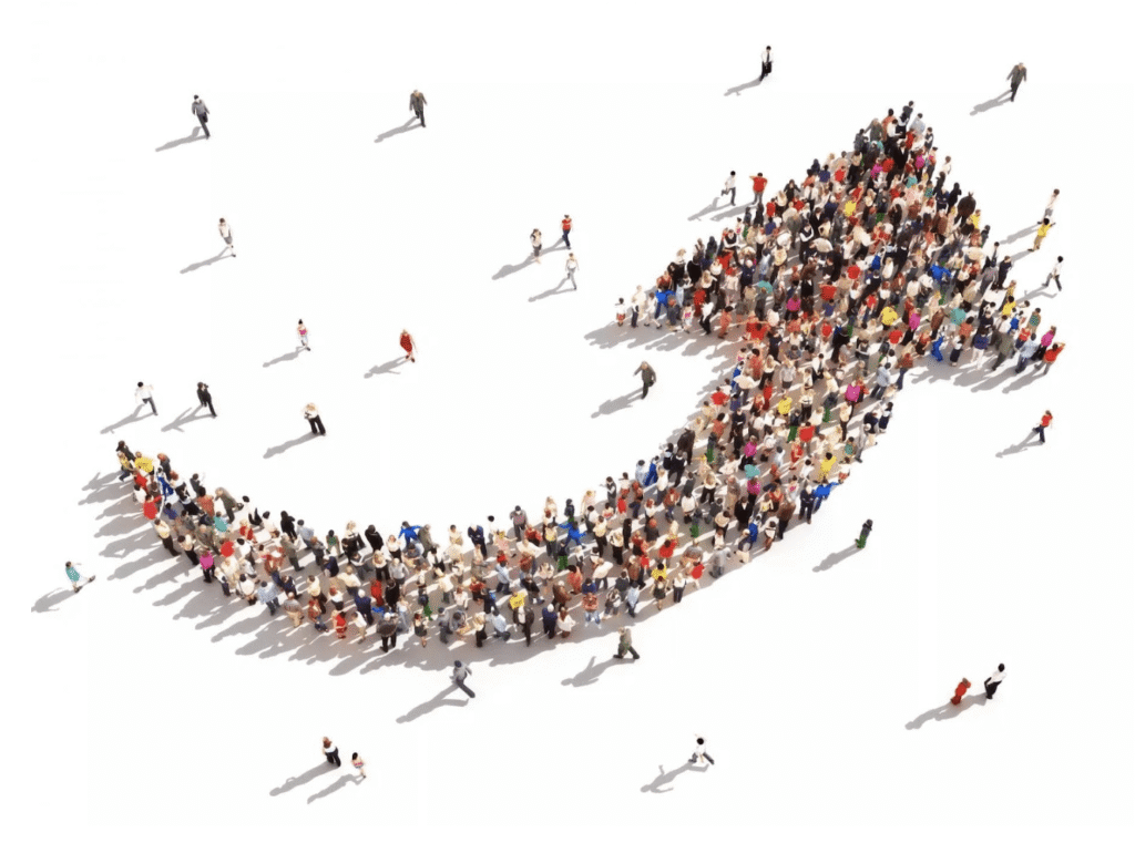 A crowd of people forming an up sign