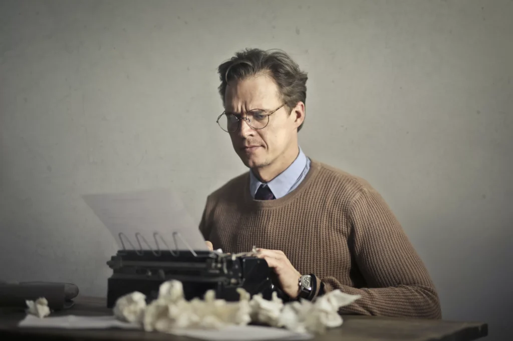 man using typewriter